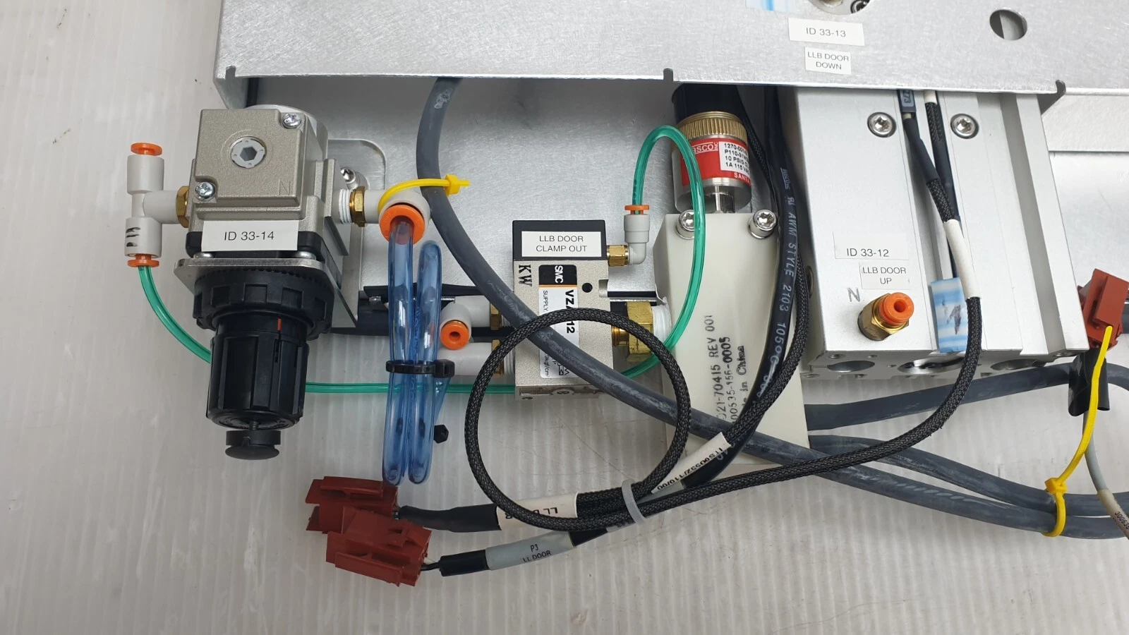 Pneumatics tagged ID 33-14, LLB DOOR CLAMP OUT and LLB DOOR UP on the 0020-02590
