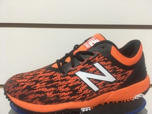 new balance orange turf shoes
