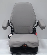 Tractor Suspension Seat w/ Adjustable Armrest Made in Light Gray Leatherette.
