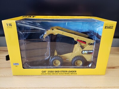 Diecast Masters CAT 272D2 Skid Steer Loader Includes Brush Drill Forks Bucket