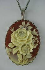 Vintage Cameo Necklace on Chain Red Background Cream Flowers