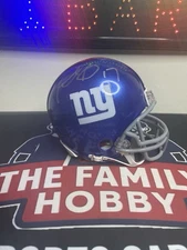 Plaxico BurressAutographed Giants Mini Helmet COA INCLUDED AND AUTHENTICATED