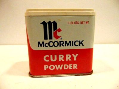old, empty, McCormick 1 1/4 oz. Curry Powder tin can with plastic cap