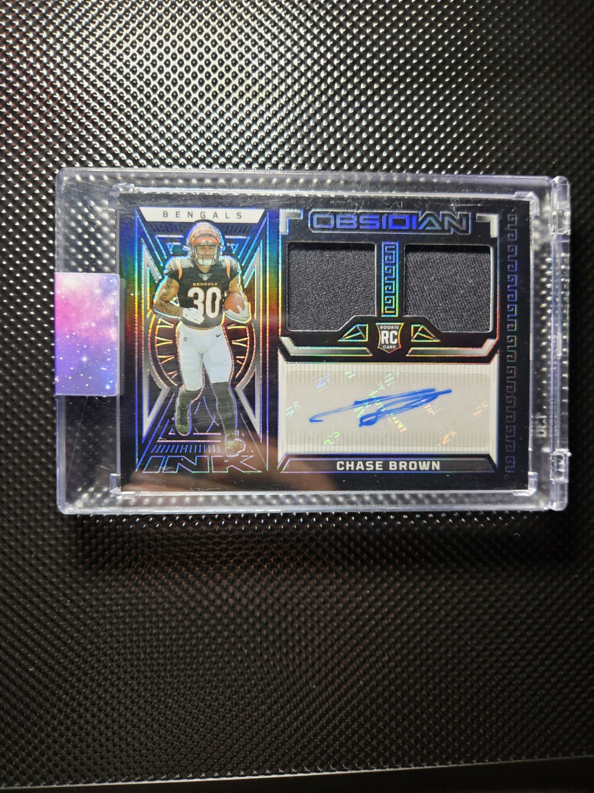2023 Panini Obsidian - Chase Brown Rookie Patch Auto RPA /199 (AU, MEM, RC)