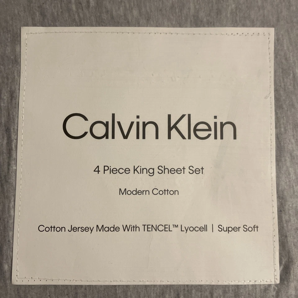 Juego de sábanas Calvin Klein 4 piezas King moderno algodón malange jersey gris/azul  Foto 2 de 4