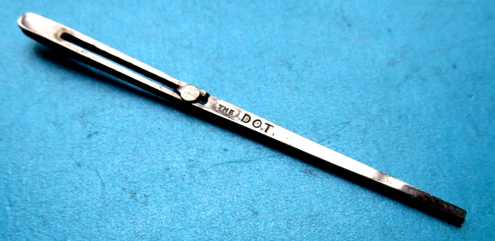 ANTIQUE METAL SLIDING BUTTON "THE DOT" SEWEING RIBBON THREADER TOOL. eBay