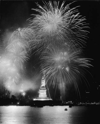 Fireworks explode around Statue of Liberty duiring American Bicente- Old Photo
