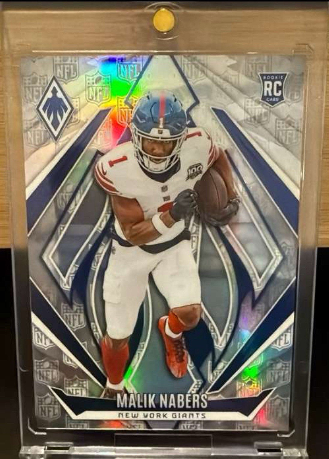 2024 Panini Phoenix - Rookies Malik Nabers #221 NFL Shield /150 (RC)