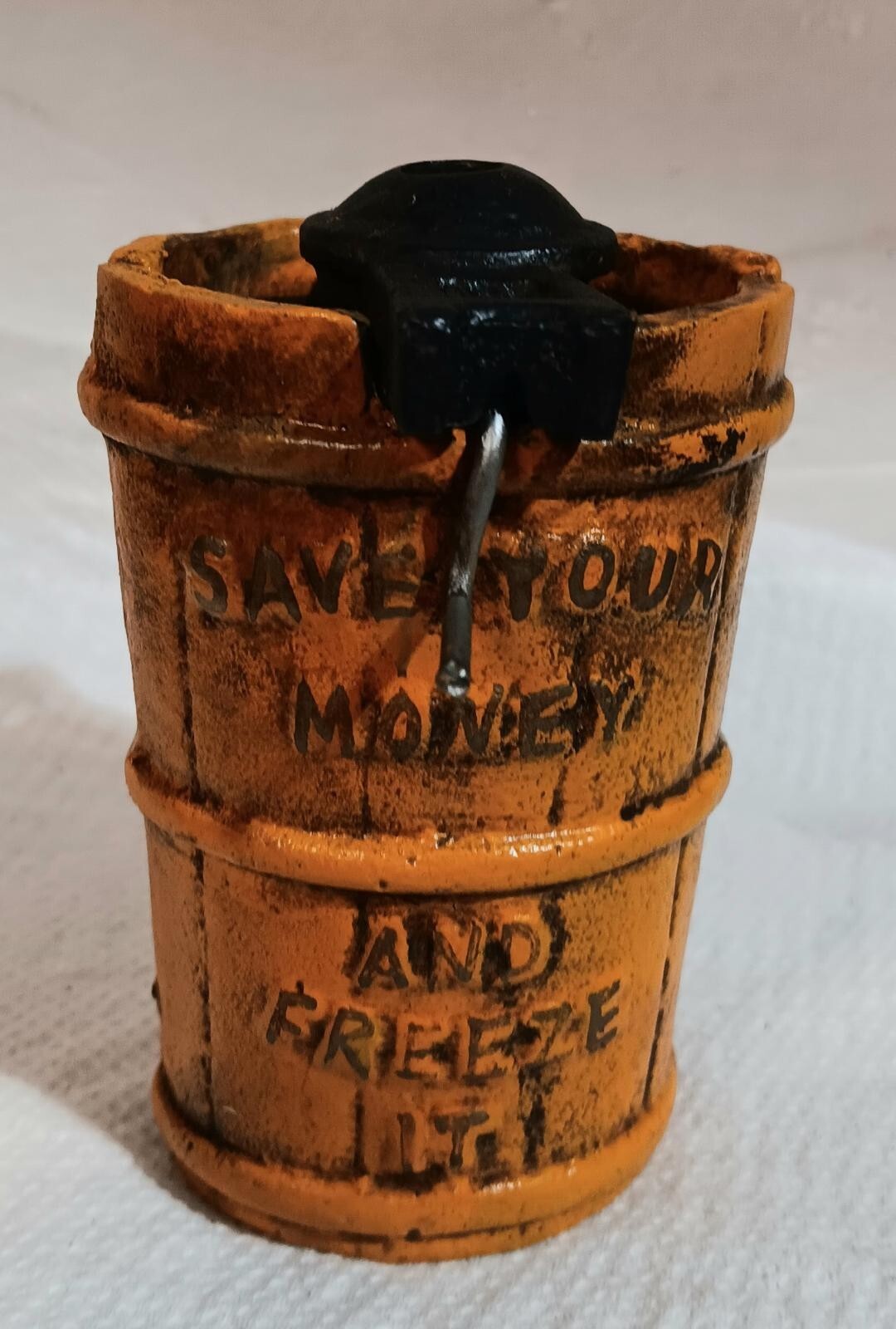 Heavy-duty cast iron ice cream bank for saving money