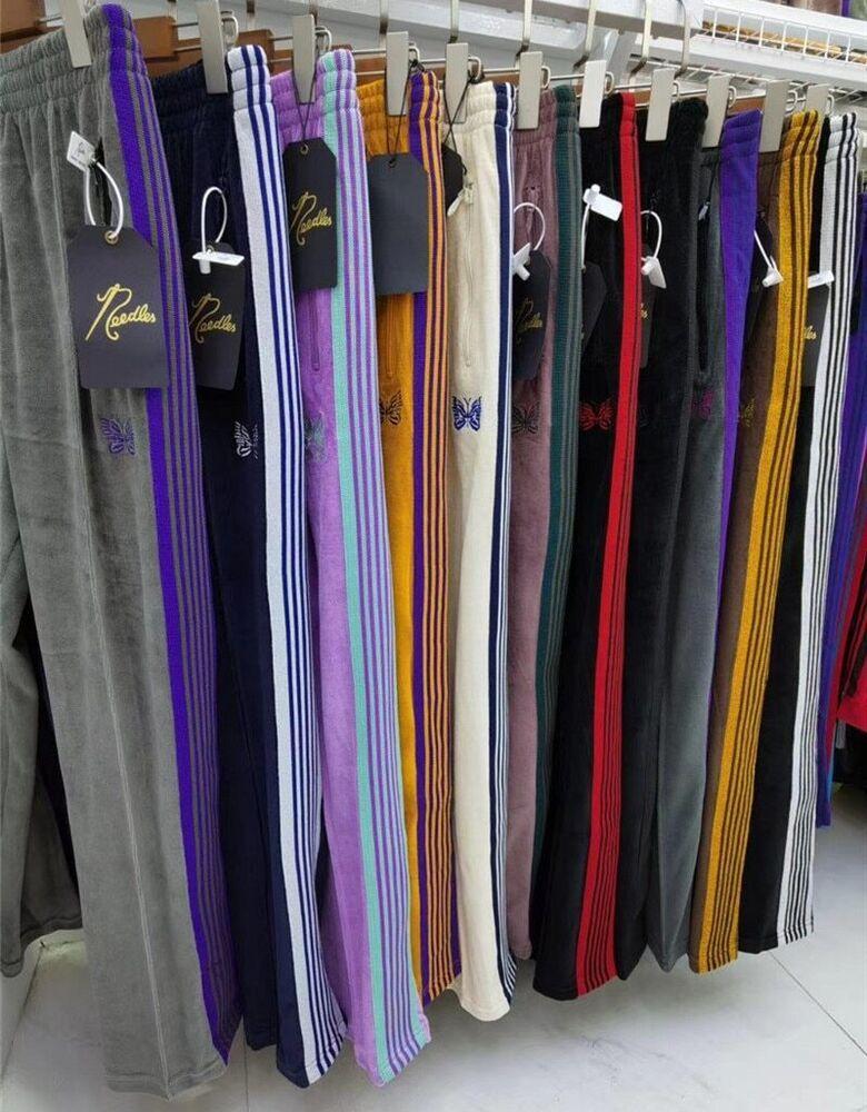 Pantalones con agujas Pantalones rocosos Hip Hop Mariposa bordado Pista Pantalones deportivos Pantalones