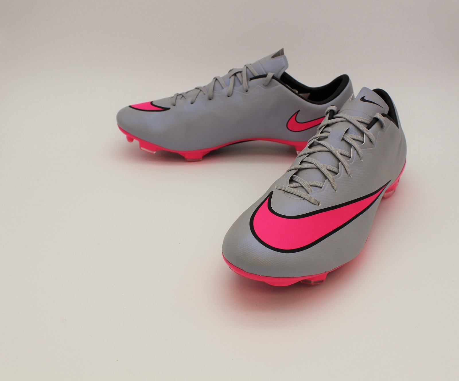 grey and pink nike soccer cleats