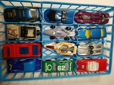 Lot 32 Hot wheels diecast Cars w/ case