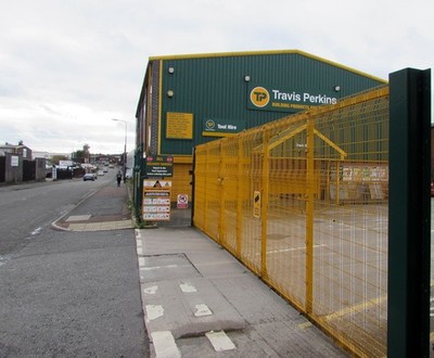 Photo 6x4 Yellow entrance gate, Travis Perkins, Wigan Opposite the A49 Qu c2017