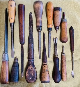 Lot of 13 antique assorted turnscrews, wood carving, cooper, and tanning tools