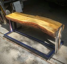 Custom rustic lodge, skis and wood log bench, ponderosa pine, beetle kill wood.