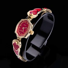 Vintage women's gold-plated wristwatch. Chaika watch with red enamel and rubies.