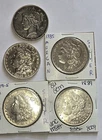 1885, 1889, 1891, 1902 MORGAN SILVER DOLLARS AND ONE 1923 PEACE DOLLAR.