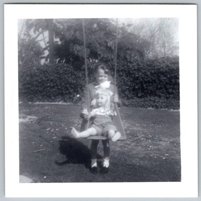 Vtg B&W Snapshot Girl With Large Doll On Backyard Garden Swing Set Play 1950s