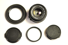 Canon 50mm f1.8 FD manual focus lens with filter, caps and hood.