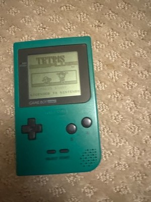 Comes with Tetris plus green hand held still works you might need to turn it off