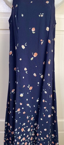 Navy blue midi dress with small white floral print, long sleeves, fitted waistline, and “E.D. Michaels” label on neckline.