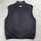 Dark gray Polartec fleece golf vest with high collar, front zipper, and small white logo on left chest.