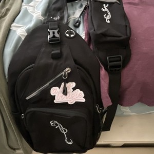 Black Crossbody Backpack with graphics, 4 Zip Pockets and  Adjustable Strap