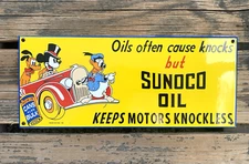 VINTAGE 15x6.25" SUNOCO OIL DISNEY GASOLINE SERVICE PORCELAIN PUMP STATION SIGN