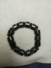 7" Bracelet Features Shiny Concave Stones And 4mm Round Beads. On Stretch Cord