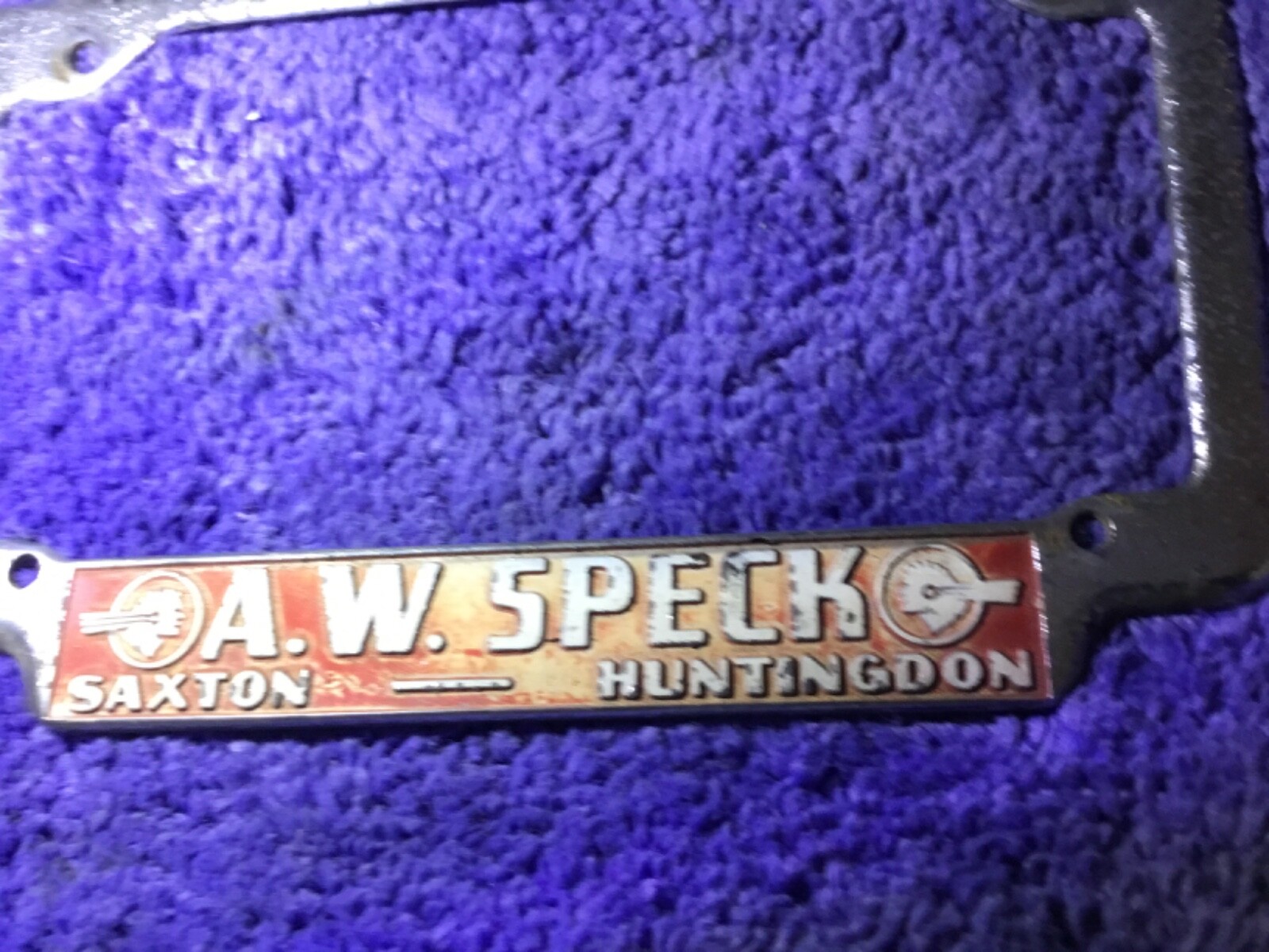 Vintage Pontiac dealership license plate frame A.W. Speck Saxton