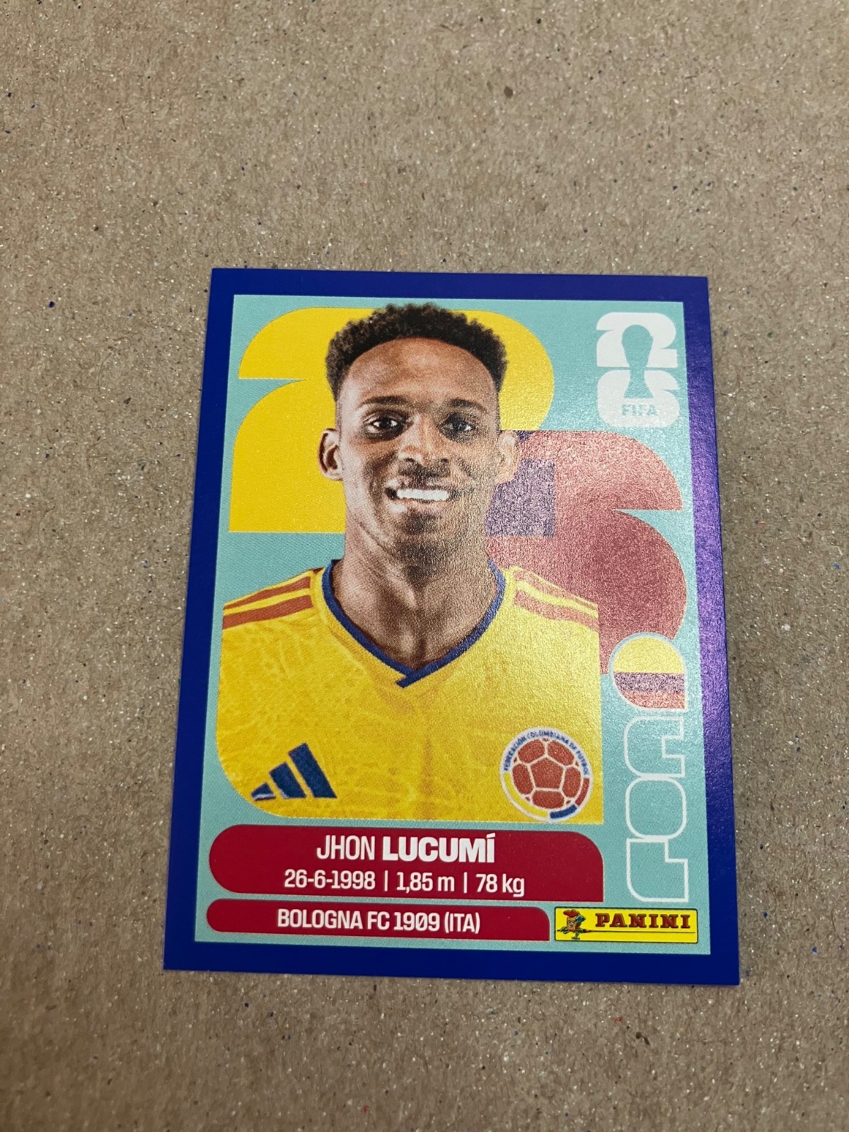 Jhon Lucumi 2026 Panini FIFA World Cup Sticker Blue Border COL 2