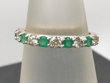 emerald and diamond half eternity ring 9ct gold uk size O, claw set, natural.