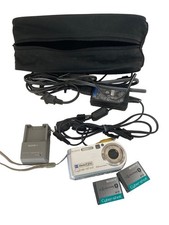 Sony DSCP150 7MP Digital Camera with 3x Optical Zoom Silver PLUS Cords Charger
