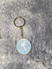 Blue And Gold Keychain That Spins To Different Options