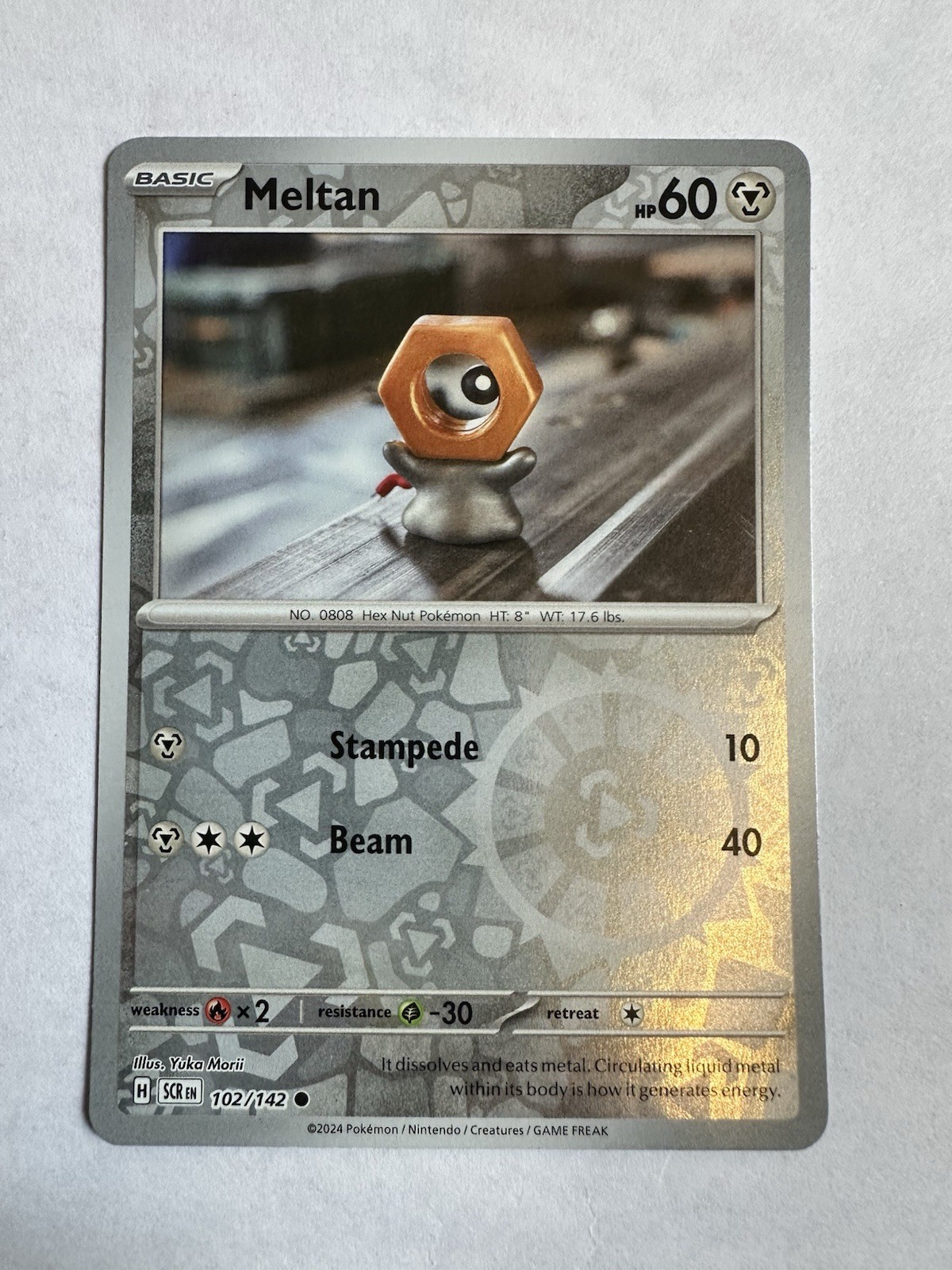 Meltan 102/142 Common Stellar Crown Pokemon Reverse Holo Near Mint