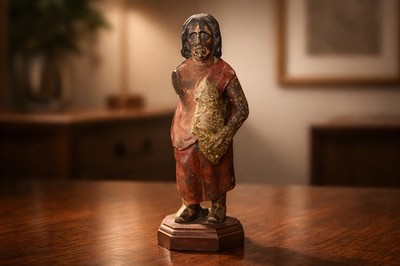 Antique primitive carved wooden figure of a woman holding an animal 6.5  Tall