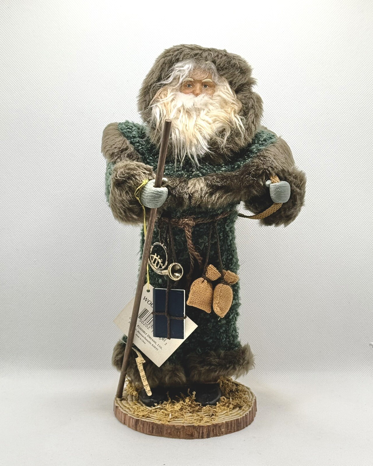 Woodland Santa Figure with Green Coat, Toy Basket, and Rustic Beard for Earthy Holiday Decor