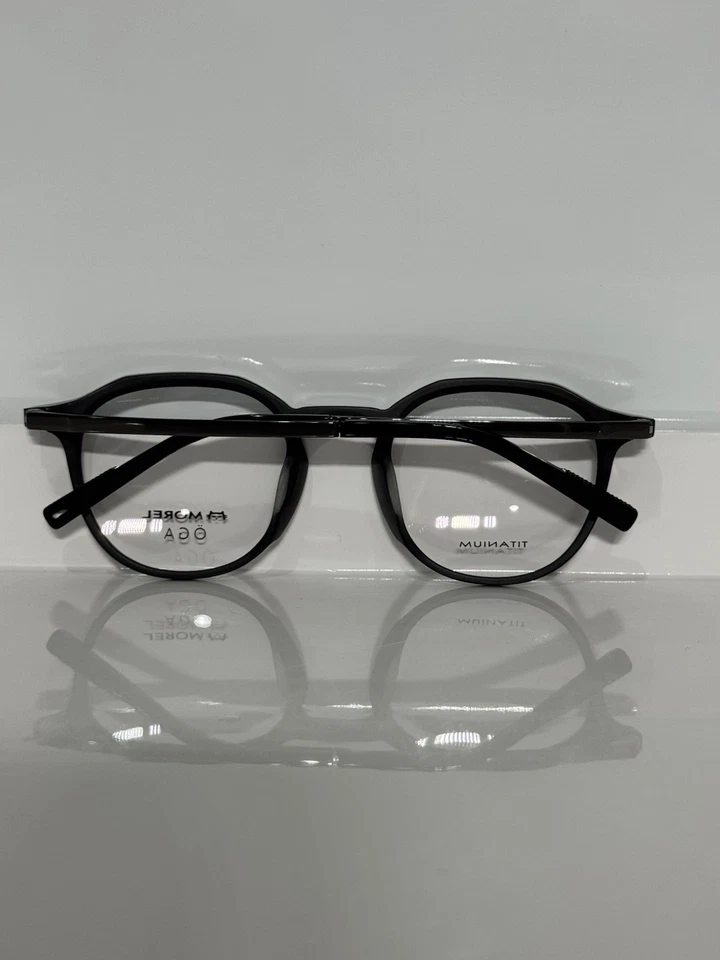 Anteojos Morel OGA 10153O NG10 Textura Redonda Negro Acetato Titanio Brazos Foto 4 de 4