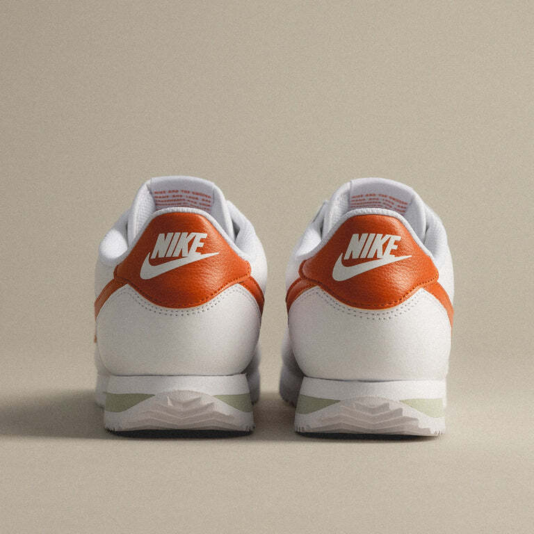 orange and white nike cortez
