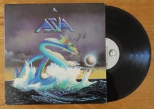 Guitarist STEVE HOWE of ASIA signed 1982 RECORD "Heat of the Moment" PSA AP41386
