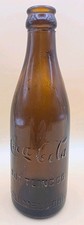 Early 20th-century amber glass Coca-Cola straight-side bottle. Columbus Ohio