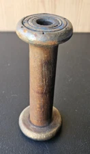 ANTIQUE WOOD SPOOL.  SOLID WOOD. METAL BAND ON ONE END. PATINA. 5 1/2 INCH
