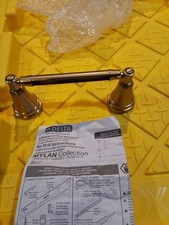 Delta Mylan Pivoting Wall-Mount Toilet Paper Holder - Champagne Bronze BLEMISHED