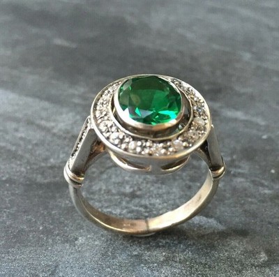 Elegant Oval Cut Lab-Created Emerald Halo Art Deco Style Sterling Silver Ring