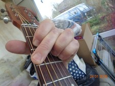 wide neck acoustic guitar