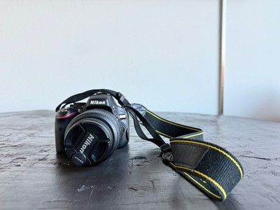 Nikon D5100 DSLR Camera Kit w/ 18-55mm Lens Incl Charger, Lens cap, Box