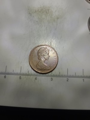 The Queen Elizabeth  II 1867-1967 Centennial Canadian One Cent Rare Off Center