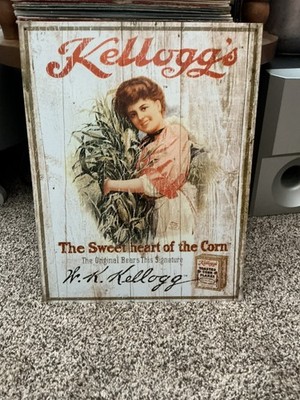 REPRODUCTION TIN SIGN FEATURING VINTAGE KELLOGGS CORN FLAKES