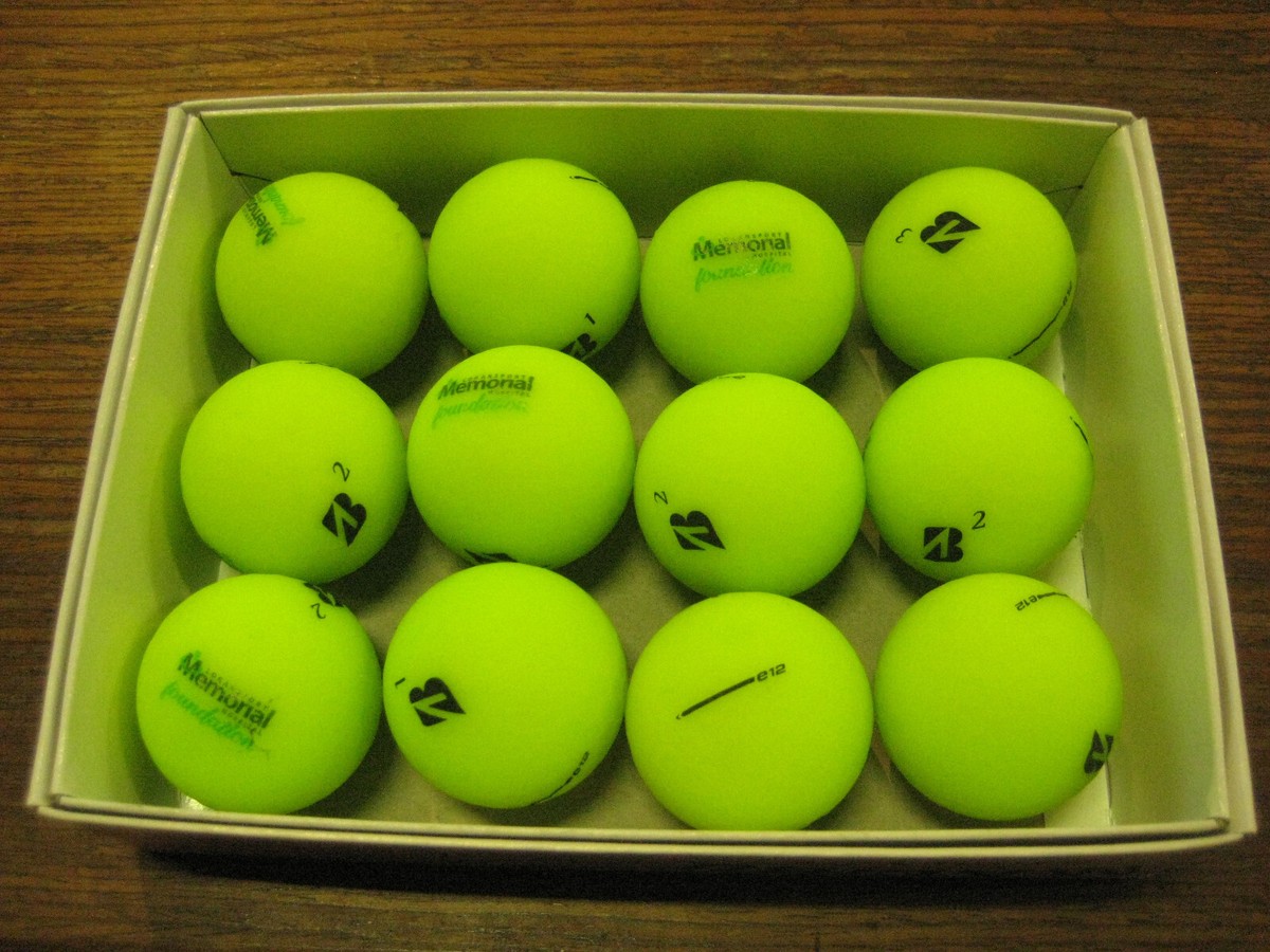 2 dozen BRAND NEW Bridgestone E12 golf balls Green Memorial