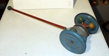 VINTAGE METAL TIN CHILD'S PUSH TOY, WHEELS, NOISEMAKER
